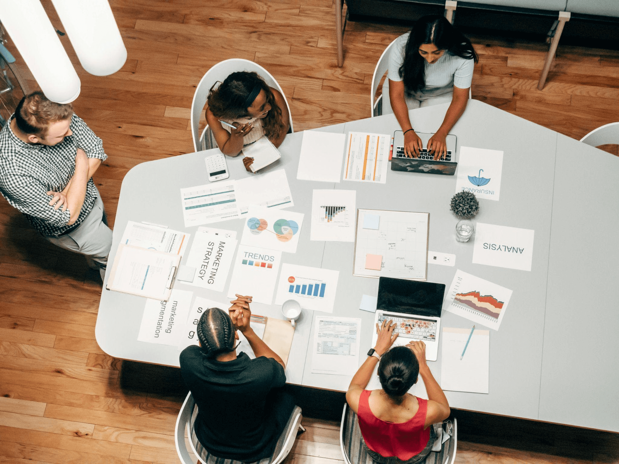 A team coming up with a digital marketing strategy for a micro-influencer campaign