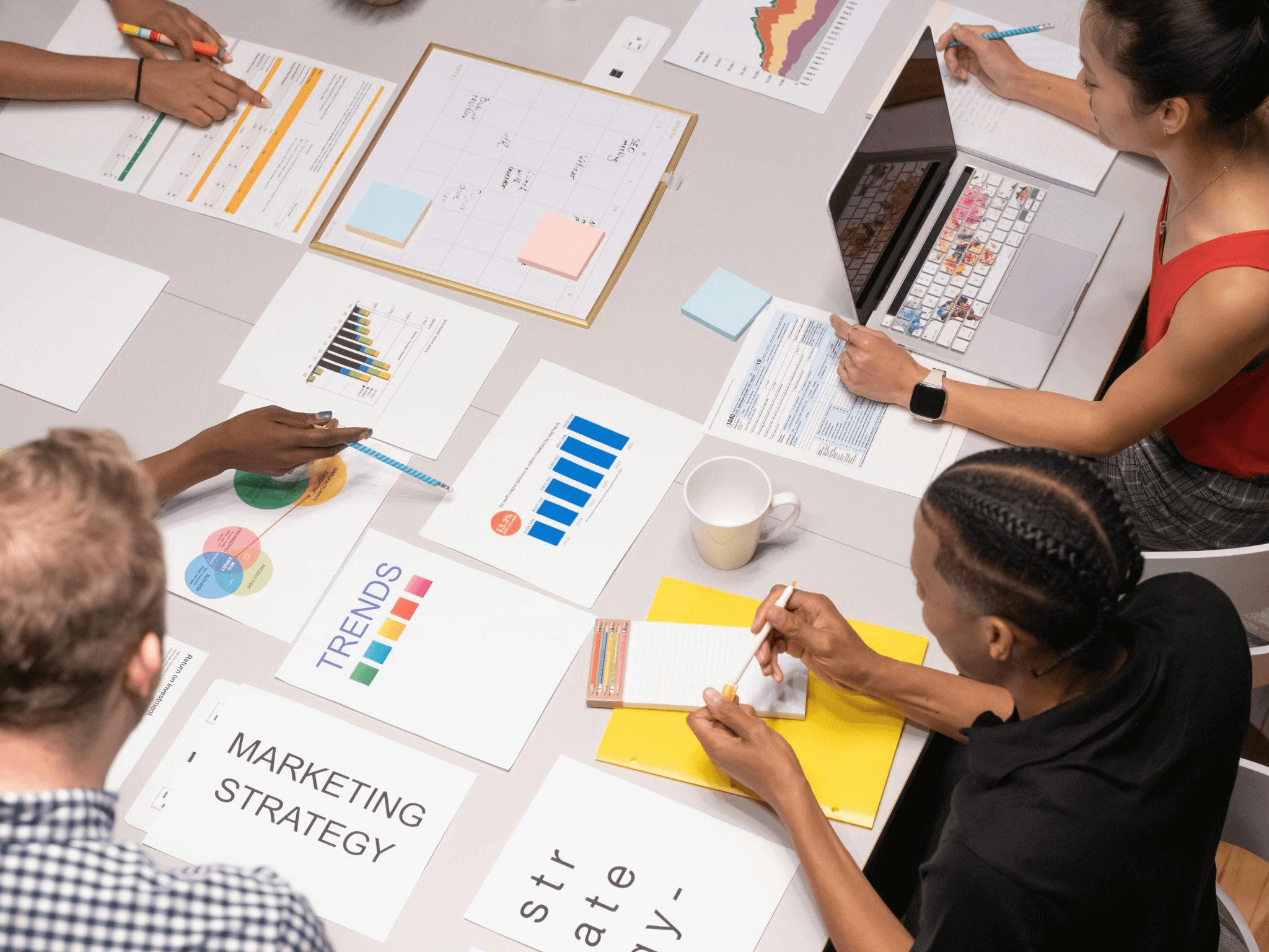 A marketing team developing a strategy at a table.