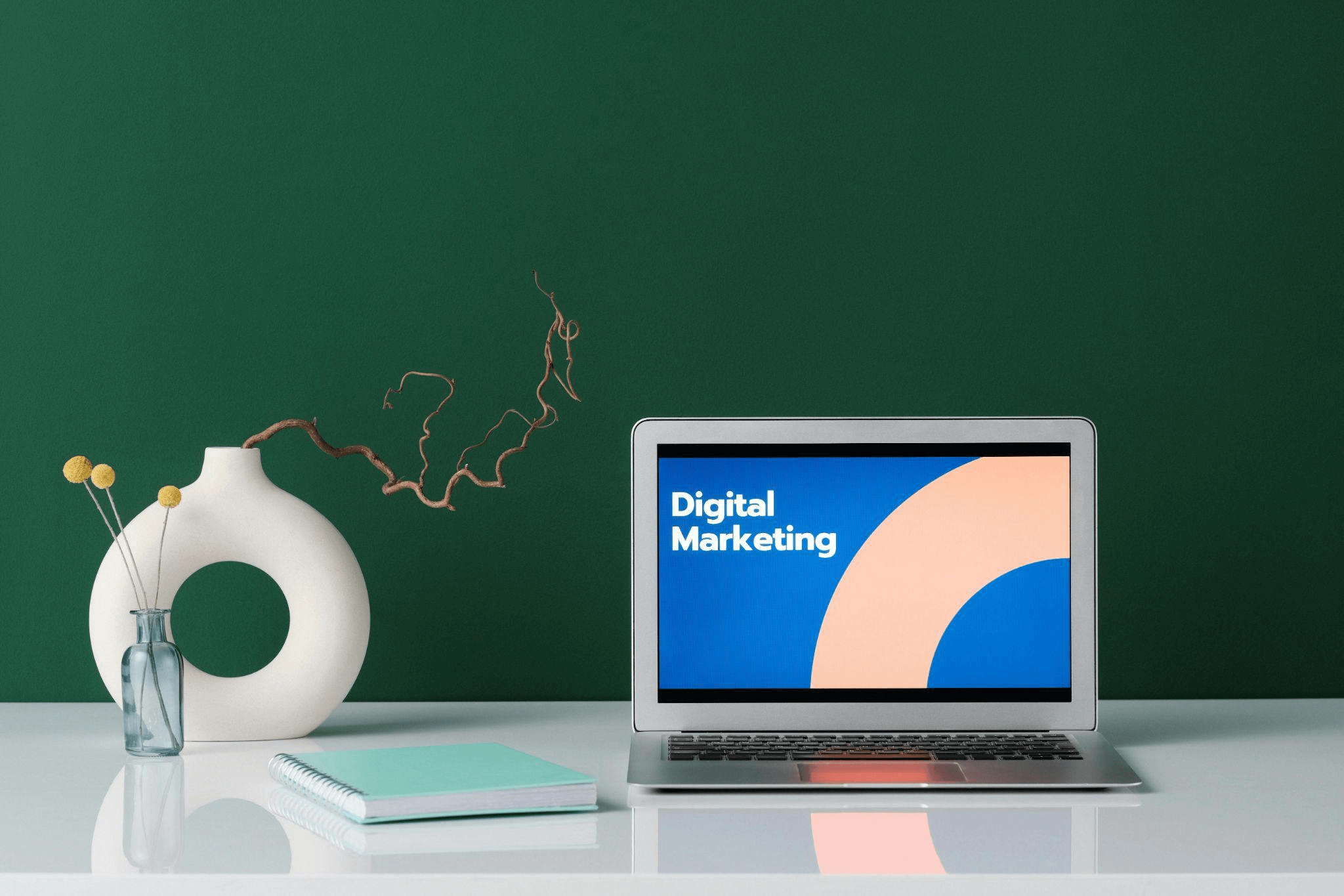 A laptop with Digital Marketing displayed on the screen