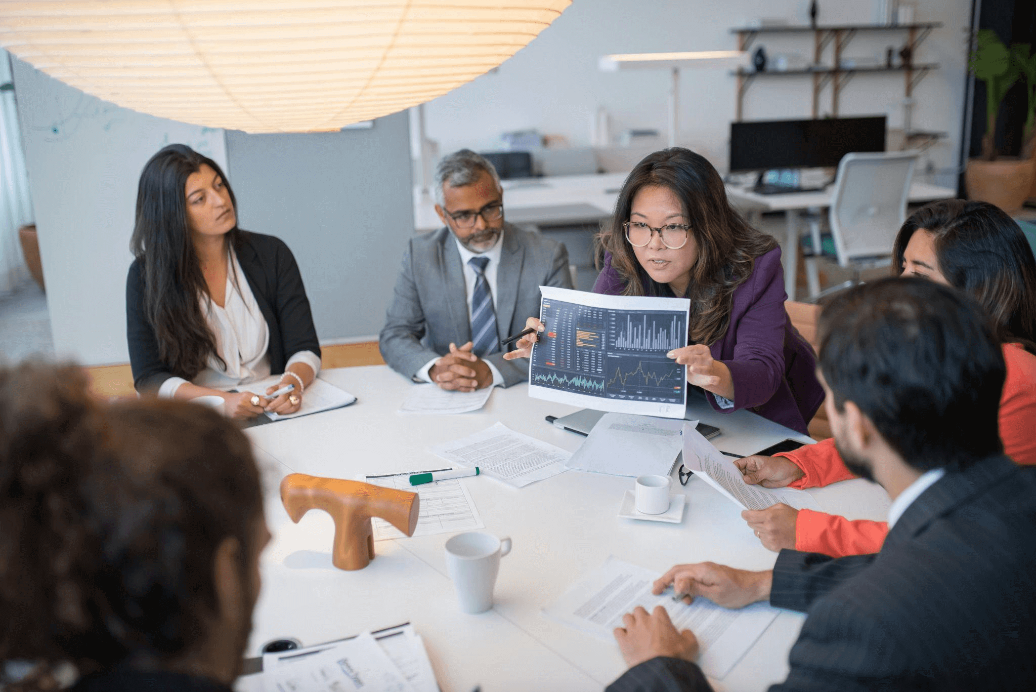 A group of professionals discussing strategy, representing a content writing service focused on hyper-personalized content creation for enhanced customer engagement.
