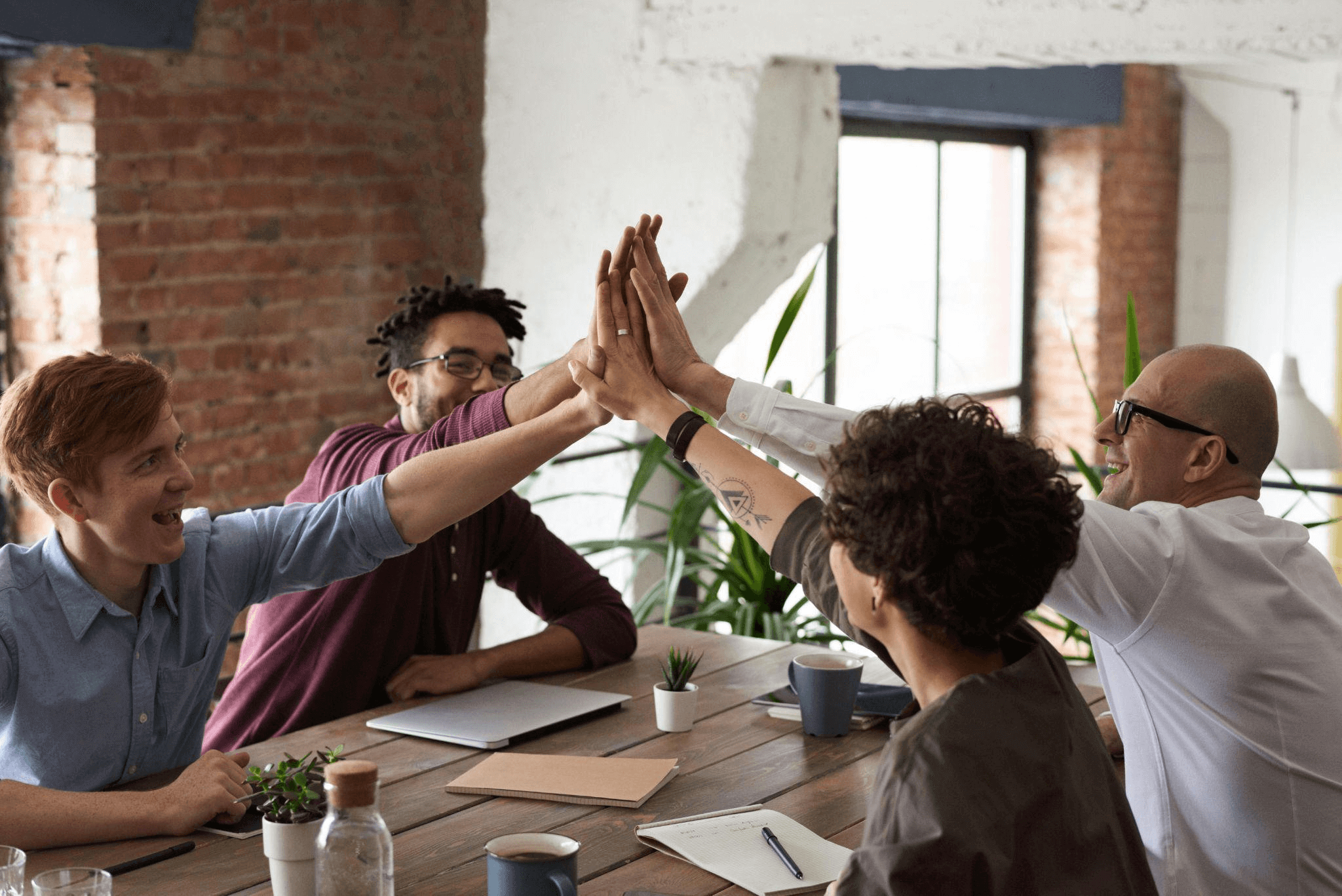 A group of individuals collaborating, symbolizing the human creativity driving the latest SEO trends.