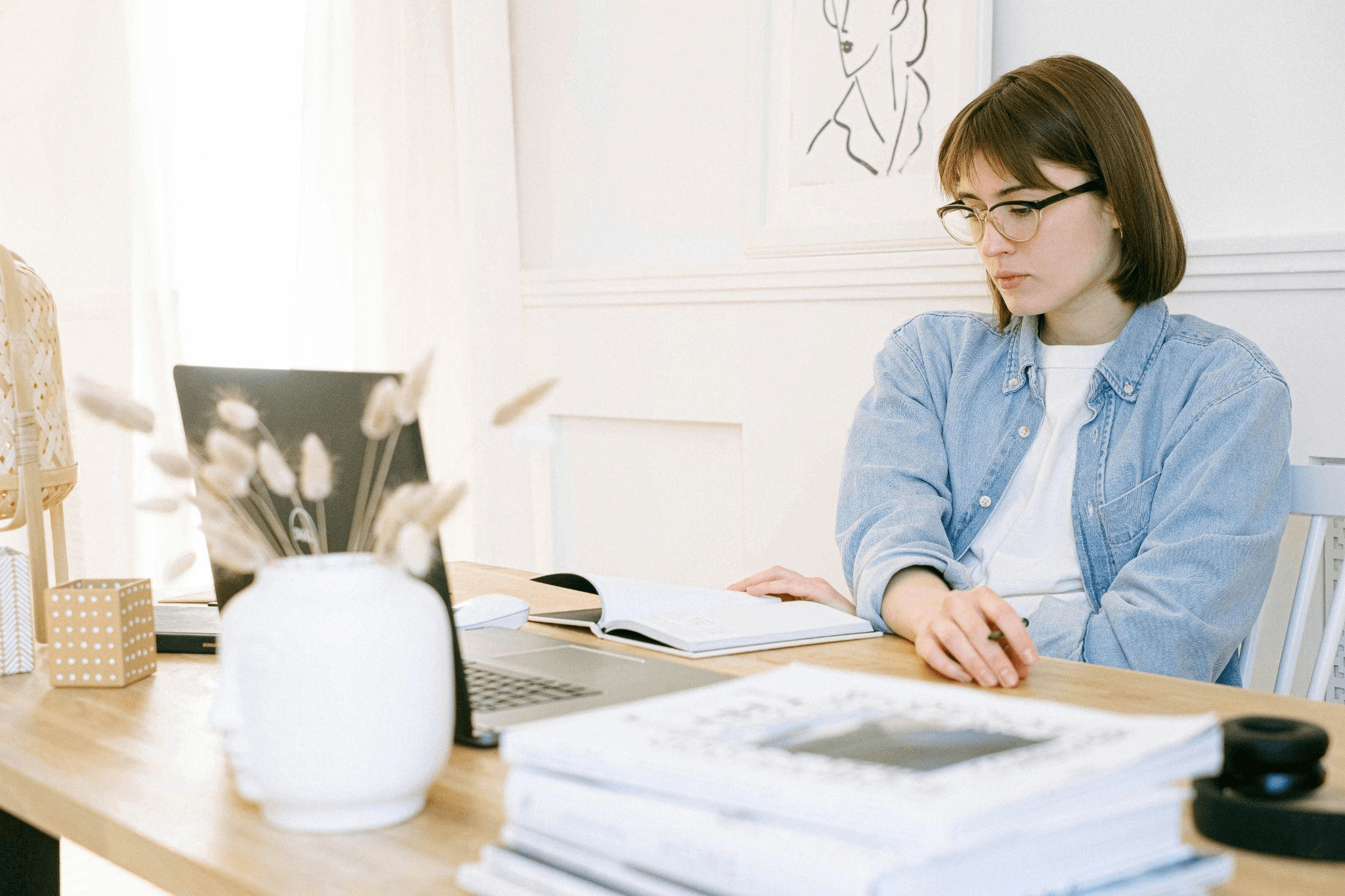 Woman researching on a laptop, preparing to start a blog with the help of a blog writing service.