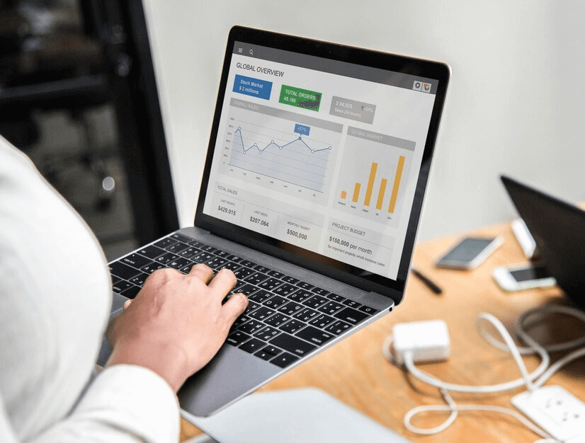 Person analyzing performance metrics on a laptop, representing efforts to increase Google Business Profile traffic.
