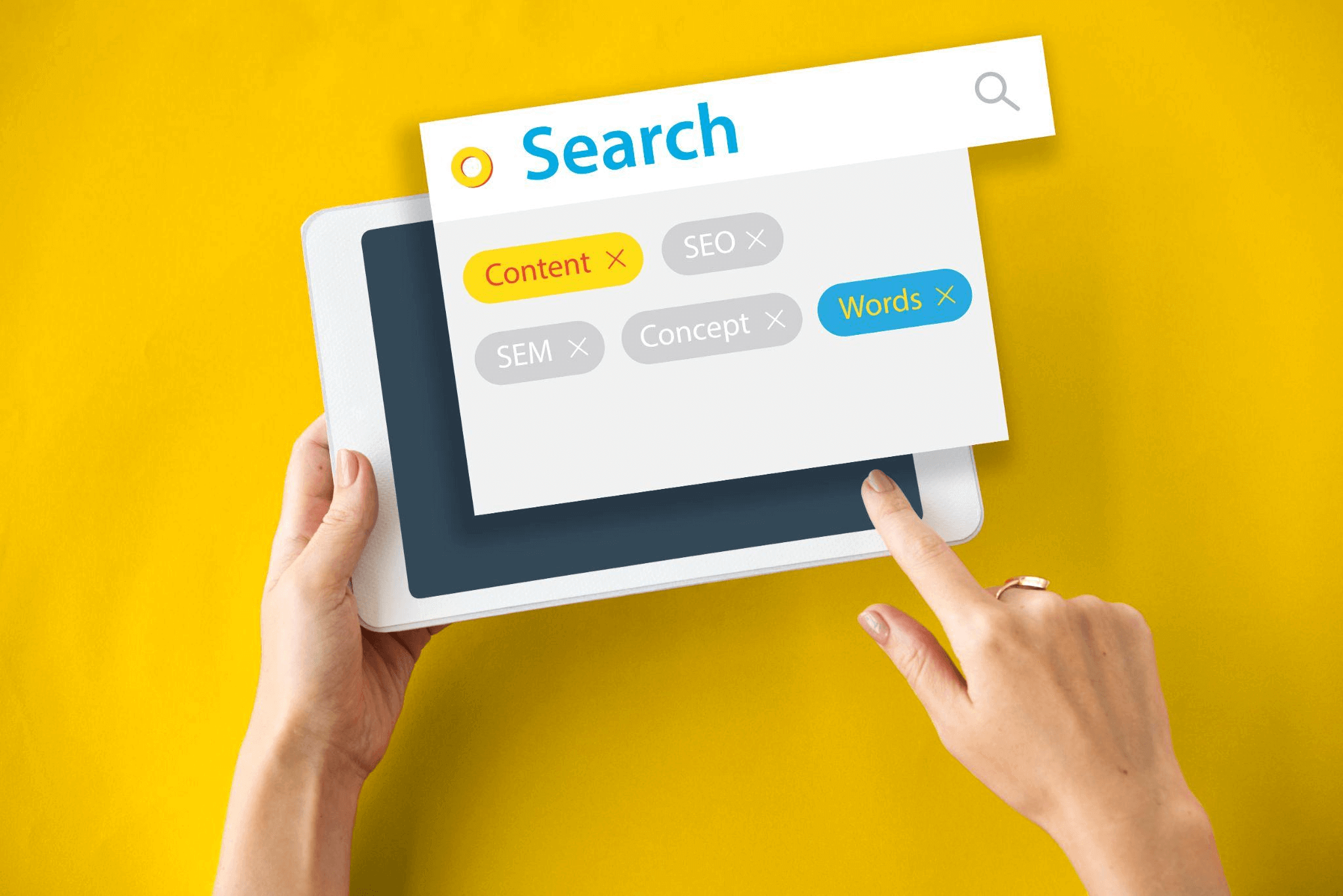 Colorful representation of keyword research with tags and SEO-related phrases displayed on a digital screen, illustrating the importance of understanding search terms for online visibility.