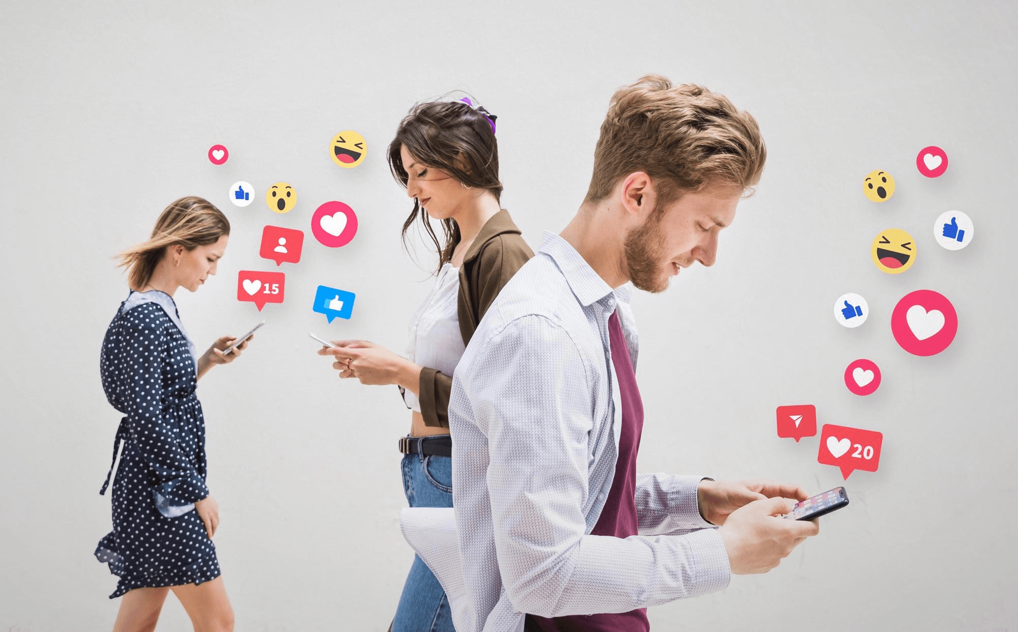 People engrossed in their smartphones, illustrating evolving social media habits and their impact on digital marketing trends in 2025.