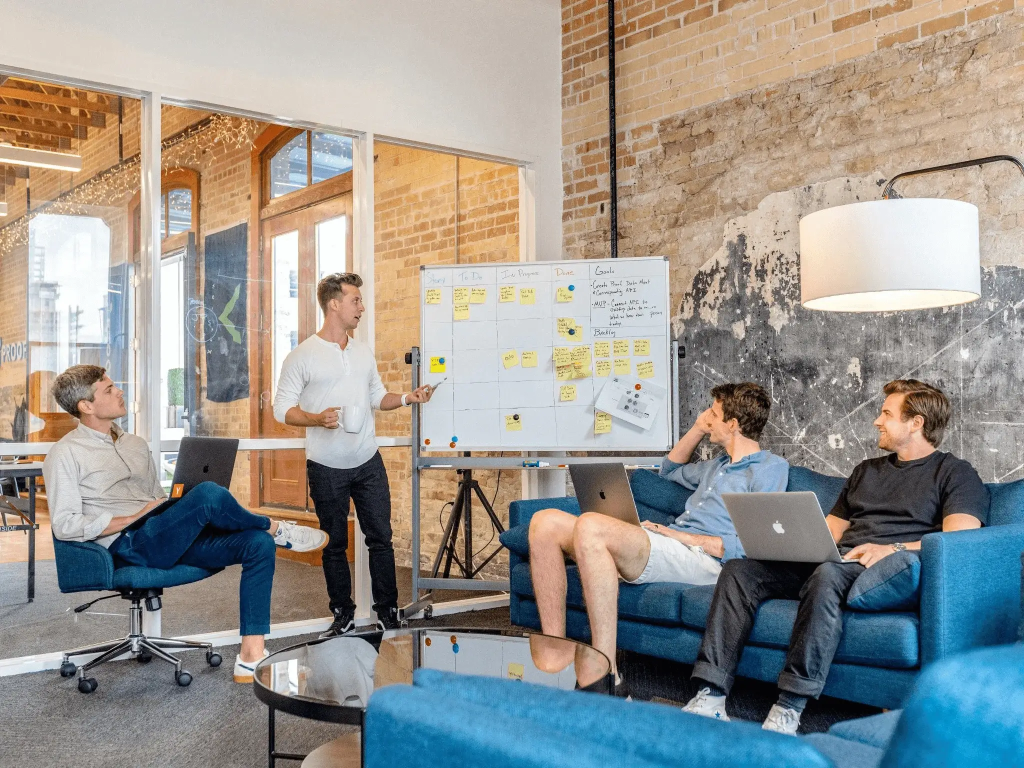 Team reviewing lead generation cost per lead figures during a brainstorming session